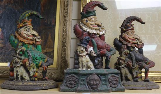 Three cast iron Mr Punch doorstops